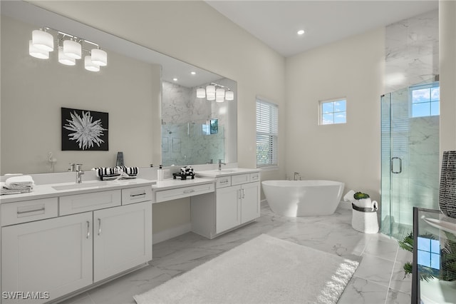 full bathroom featuring a shower stall, a sink, two vanities, a freestanding bath, and marble finish floor