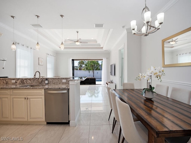 kitchen with light stone counters, a tray ceiling, dishwasher, crown molding, and sink