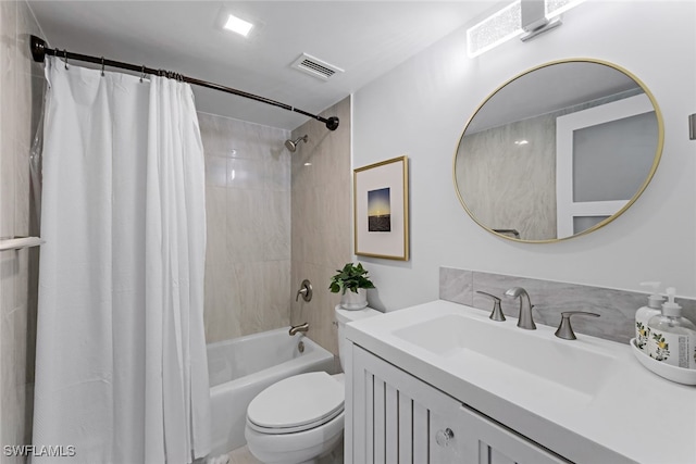 full bathroom featuring vanity, shower / bath combo, and toilet