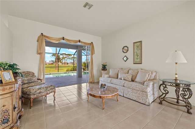 living room featuring visible vents and light tile patterned floors