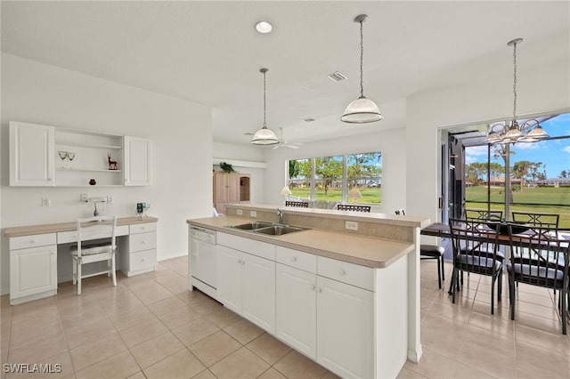 kitchen with white cabinets, a kitchen island with sink, and sink