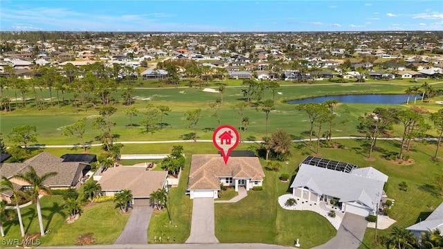 aerial view with a water view, view of golf course, and a residential view