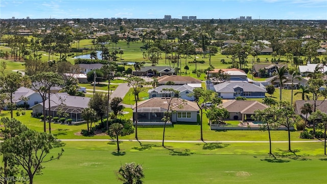 birds eye view of property featuring a residential view, a water view, and golf course view