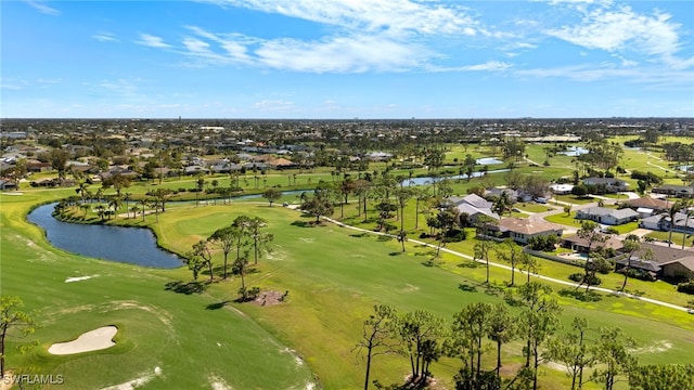 bird's eye view with a water view, view of golf course, and a residential view