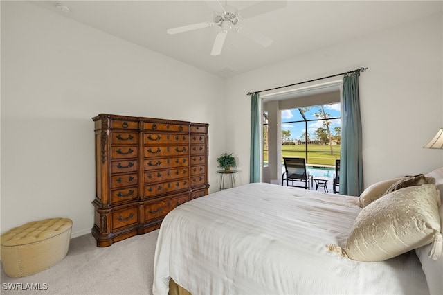 bedroom featuring access to exterior, light colored carpet, and ceiling fan