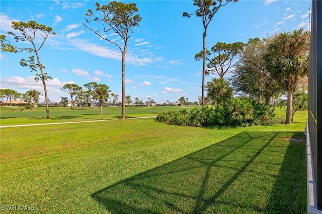view of home's community featuring a lawn