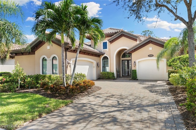 mediterranean / spanish-style home featuring a garage