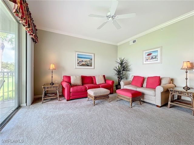 carpeted living room featuring ceiling fan and crown molding