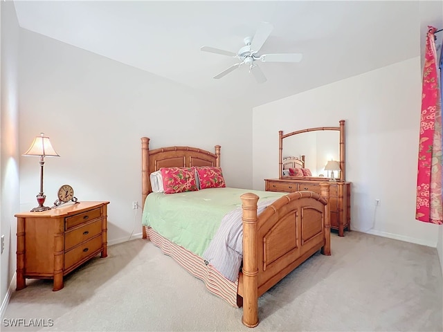 bedroom featuring light carpet and ceiling fan