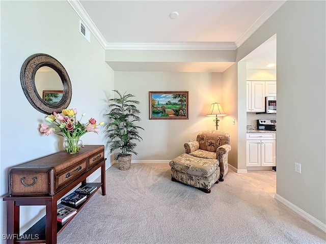 living area with visible vents, baseboards, light colored carpet, and crown molding