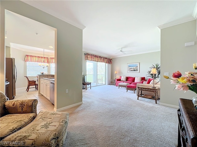 living room featuring light colored carpet, ceiling fan, and crown molding