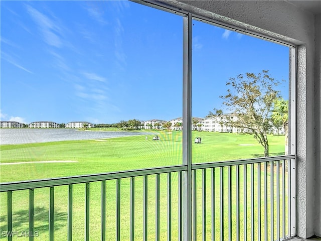 unfurnished sunroom with a water view