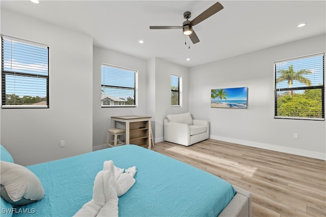 bedroom featuring ceiling fan and light wood-type flooring