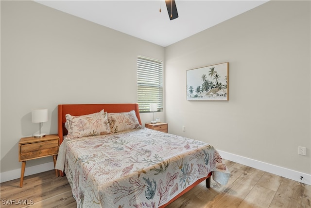 bedroom featuring hardwood / wood-style floors and ceiling fan