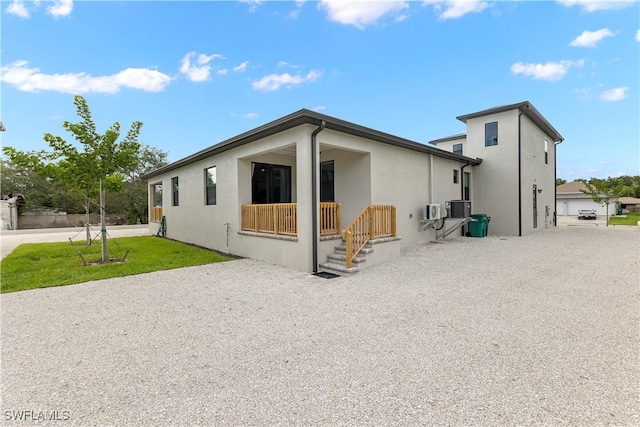 exterior space featuring central AC unit