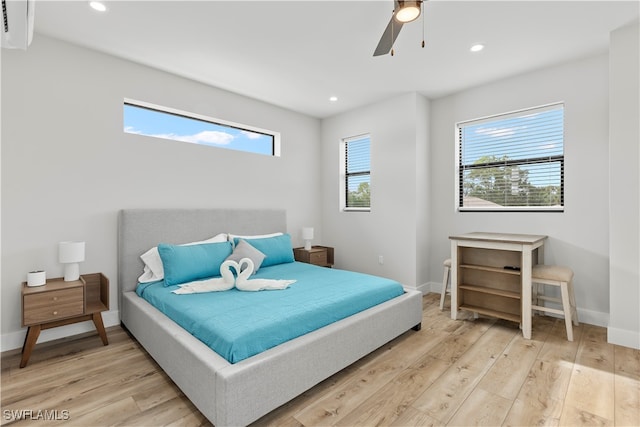 bedroom with light wood-type flooring and ceiling fan