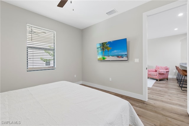 bedroom featuring ceiling fan and light wood-type flooring