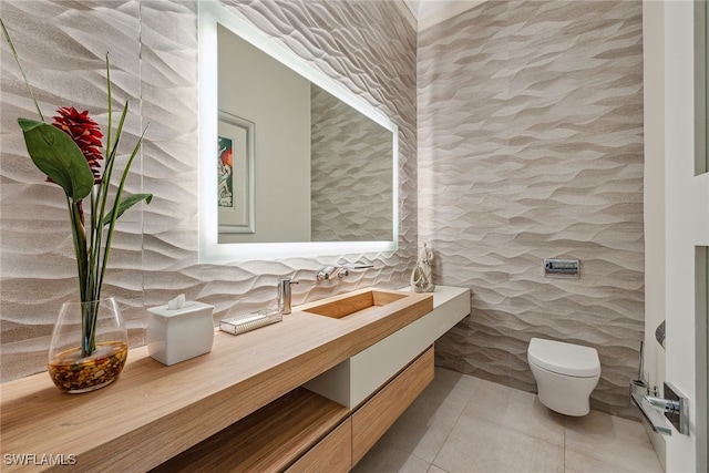 bathroom featuring tile walls, vanity, toilet, and tile patterned floors