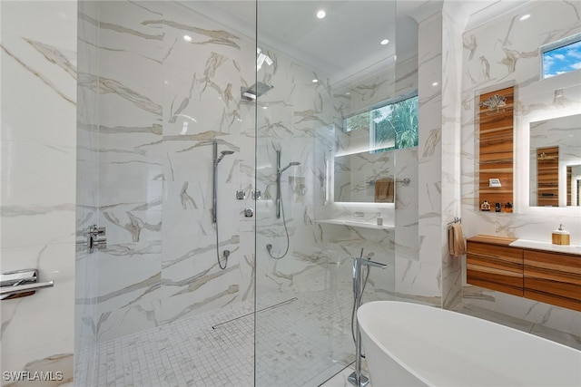 bathroom featuring tile walls, vanity, shower with separate bathtub, and ornamental molding