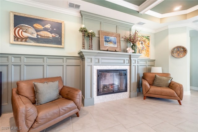 sitting room with beam ceiling, crown molding, and light tile patterned flooring