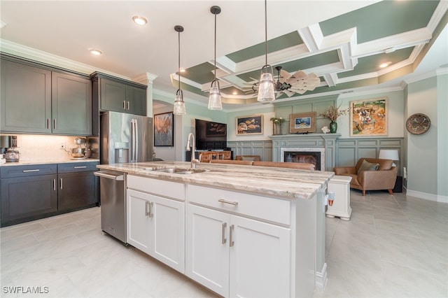 kitchen featuring coffered ceiling, stainless steel appliances, sink, decorative light fixtures, and white cabinetry