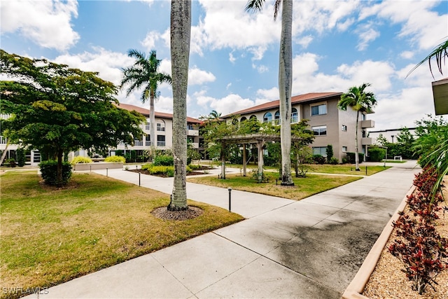 view of home's community with a lawn