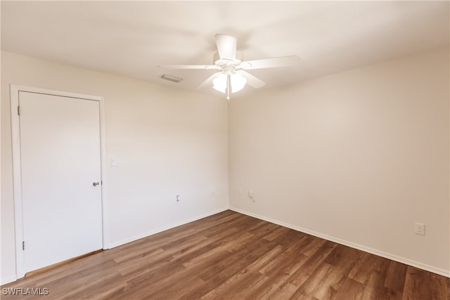 unfurnished room featuring ceiling fan and hardwood / wood-style flooring