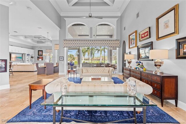 living room featuring beamed ceiling, a towering ceiling, crown molding, and coffered ceiling