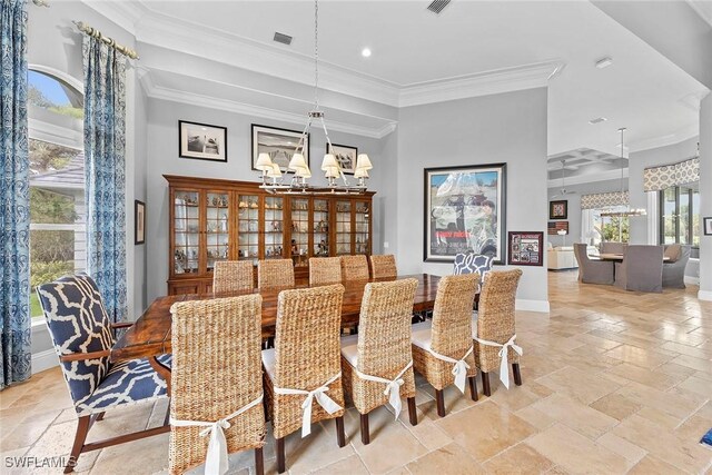 dining space featuring an inviting chandelier and ornamental molding