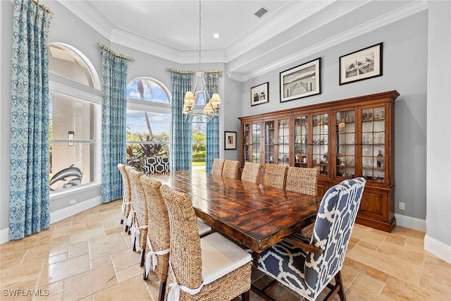 dining space featuring ornamental molding and a chandelier