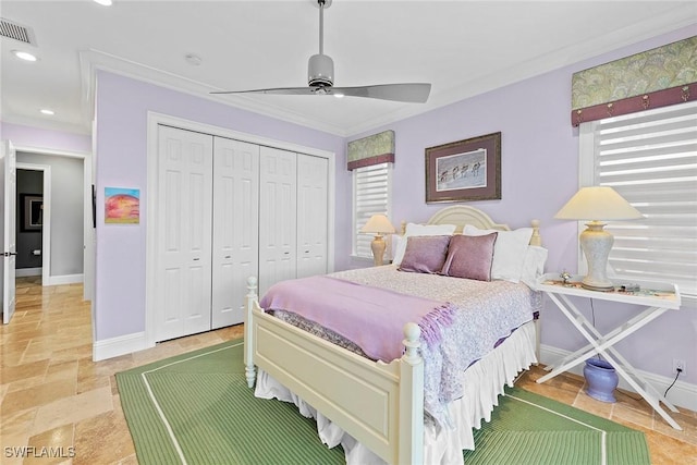 bedroom featuring ceiling fan, a closet, ornamental molding, and multiple windows