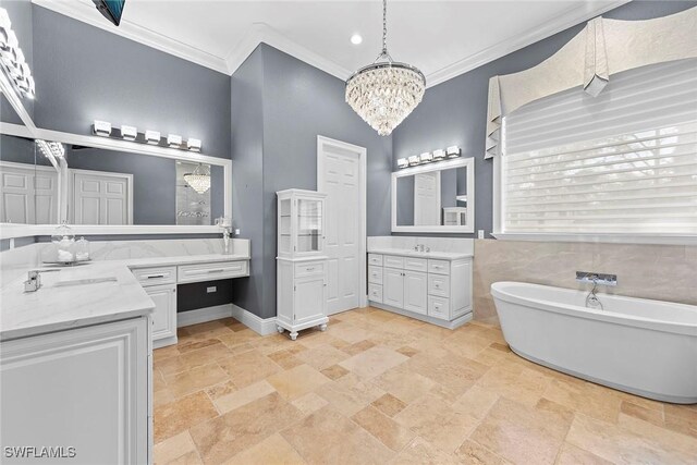 bathroom featuring vanity, a tub to relax in, crown molding, and a notable chandelier