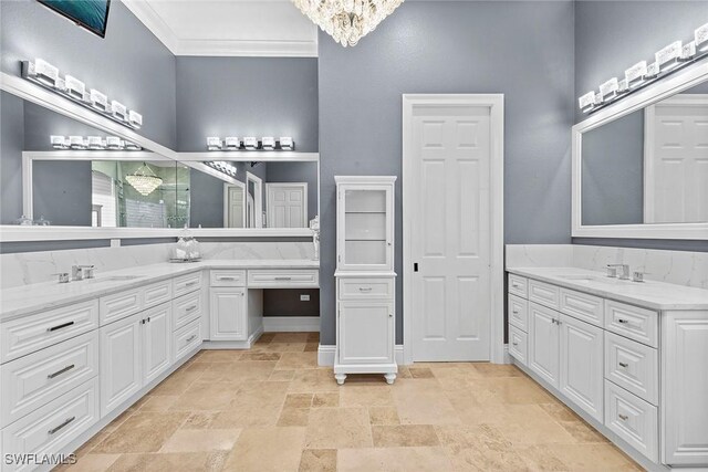 bathroom featuring a notable chandelier, vanity, and crown molding