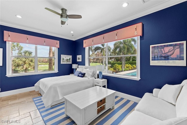 bedroom with ceiling fan and crown molding