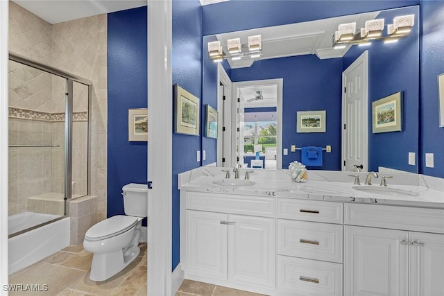 full bathroom featuring shower / bath combination with glass door, vanity, and toilet