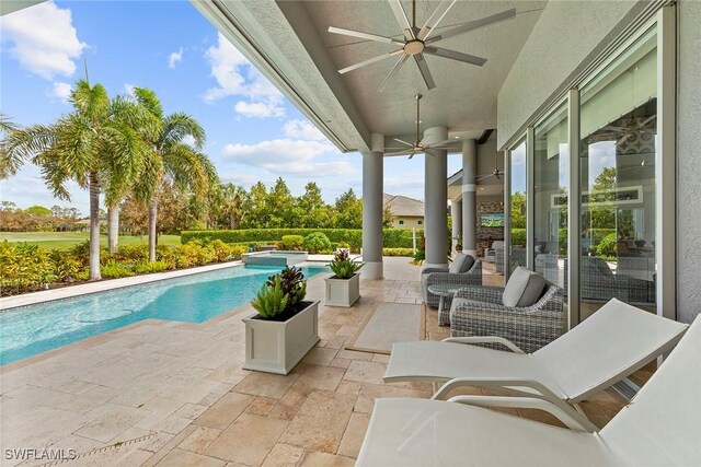 view of pool with a patio and ceiling fan