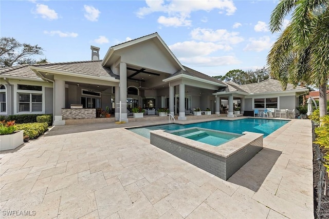 view of pool featuring an in ground hot tub, ceiling fan, and a patio