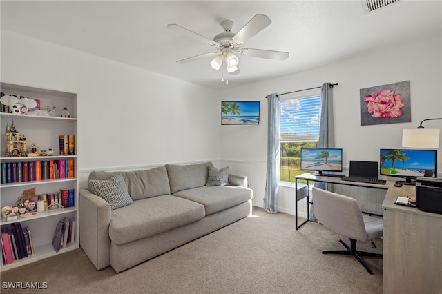 office area with ceiling fan and carpet floors