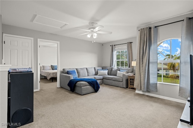 321 Shadow Lakes Dr, Lehigh Acres, FL 33974 - carpeted living area with attic access, baseboards, and ceiling fan