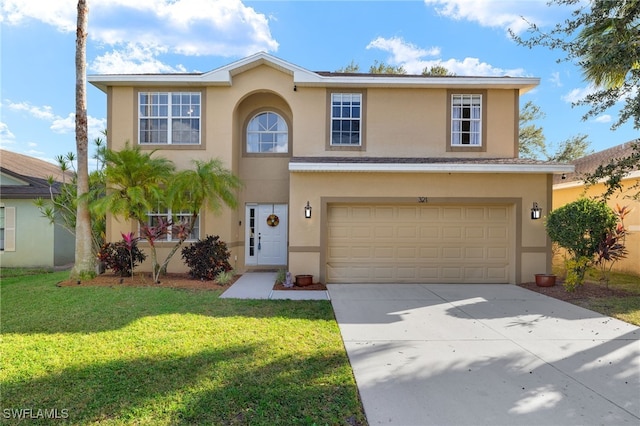 321 Shadow Lakes Dr, Lehigh Acres, FL 33974 - traditional home featuring stucco siding, an attached garage, driveway, and a front yard