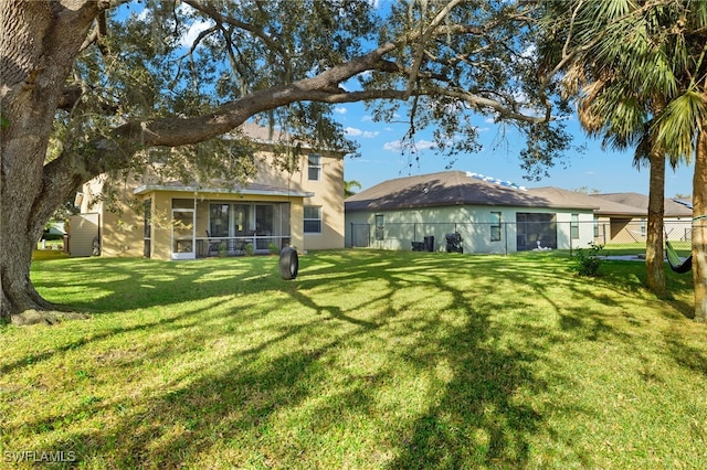 321 Shadow Lakes Dr, Lehigh Acres, FL 33974 - view of yard with a sunroom and fence