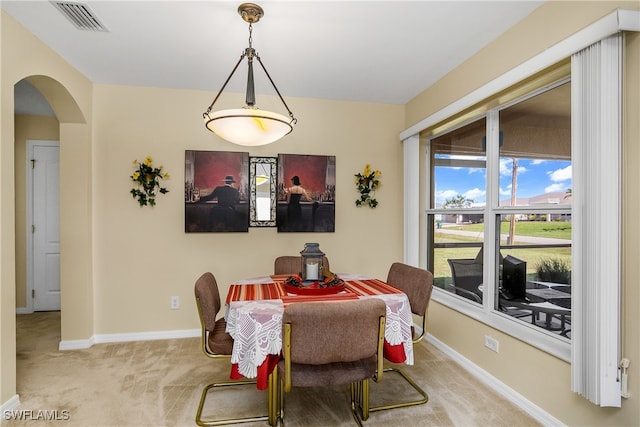 view of carpeted dining area