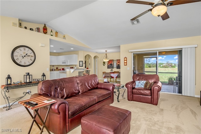 carpeted living room featuring lofted ceiling and ceiling fan