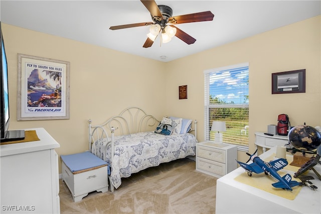 carpeted bedroom with ceiling fan