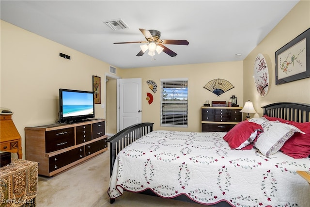 bedroom featuring light colored carpet and ceiling fan