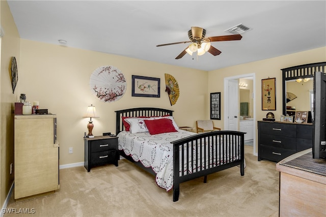 carpeted bedroom featuring connected bathroom and ceiling fan