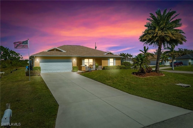 ranch-style house with concrete driveway, roof with shingles, a lawn, stucco siding, and an attached garage