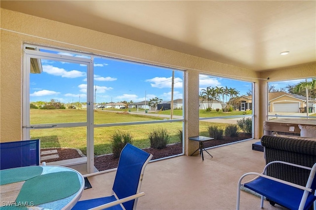 sunroom / solarium with a residential view