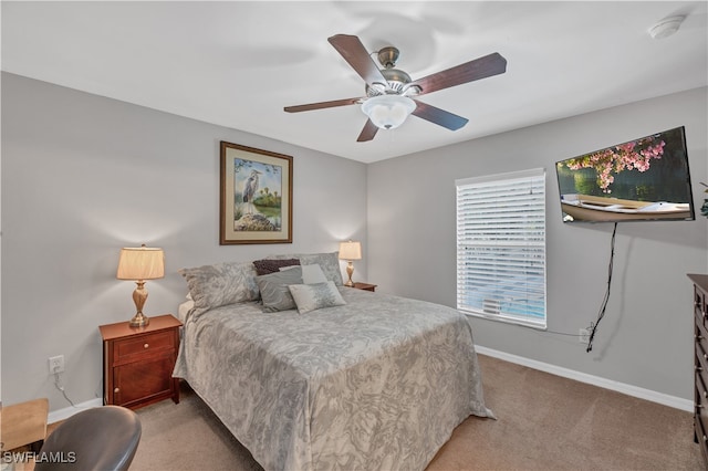 bedroom with light colored carpet and ceiling fan