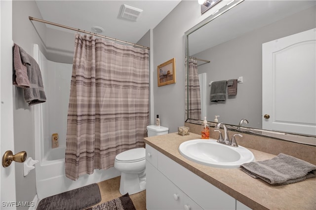 full bathroom featuring tile patterned floors, shower / bath combo with shower curtain, vanity, and toilet